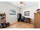 Bedroom with ample floor space, wood floors, and a ceiling fan at 10536 Shady Preserve Dr, Riverview, FL 33579