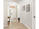 Bright entryway with beige tile, neutral walls, and arched doorway creates a welcoming ambiance to the home at 10536 Shady Preserve Dr, Riverview, FL 33579