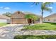 Charming single-story home with a well-manicured lawn and mature landscaping at 10536 Shady Preserve Dr, Riverview, FL 33579