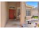 Inviting covered front porch with a vibrant red door and decorative landscaping at 10536 Shady Preserve Dr, Riverview, FL 33579
