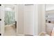 Hallway with closet and bathroom access, offering seamless connectivity at 10536 Shady Preserve Dr, Riverview, FL 33579