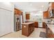 Bright kitchen featuring a center island, stainless steel appliances, and plenty of storage at 10536 Shady Preserve Dr, Riverview, FL 33579