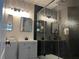 Modern bathroom featuring dual vanities, sleek fixtures, and a walk-in shower with hexagon tile at 10826 Rain Lilly Pass, Land O Lakes, FL 34638