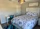 Bright bedroom with a modern bed and a desk at 10826 Rain Lilly Pass, Land O Lakes, FL 34638
