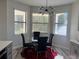 Cozy dining area with bright natural light and modern light fixtures at 10826 Rain Lilly Pass, Land O Lakes, FL 34638