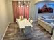 Open-concept dining room with modern lighting and comfortable seating at 10826 Rain Lilly Pass, Land O Lakes, FL 34638