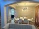 Inviting dining room with open layout, stylish lighting, and comfortable seating arrangement at 10826 Rain Lilly Pass, Land O Lakes, FL 34638