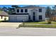 Charming two-story home with a well-manicured lawn and a spacious three car garage at 10826 Rain Lilly Pass, Land O Lakes, FL 34638