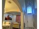 Inviting living room featuring arched doorways and modern chandelier with great natural light at 10826 Rain Lilly Pass, Land O Lakes, FL 34638