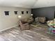 Cozy living room with comfortable seating, stylish decor, and lots of natural light at 10826 Rain Lilly Pass, Land O Lakes, FL 34638