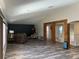 Open-concept living area with exposed wood beams, wood floors and lots of natural light at 10826 Rain Lilly Pass, Land O Lakes, FL 34638