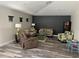 Cozy living room with comfortable seating, stylish decor, and lots of natural light at 10826 Rain Lilly Pass, Land O Lakes, FL 34638