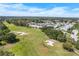 Sprawling golf course and beautiful neighborhood with mature trees, perfect for outdoor enjoyment at 1130 Hominy Hill Dr, Trinity, FL 34655