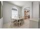 Elegant dining area adjacent to the kitchen, featuring neutral decor and tile flooring at 1130 Hominy Hill Dr, Trinity, FL 34655