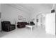 Bright living room featuring tile flooring, tray ceilings, and neutral decor at 1130 Hominy Hill Dr, Trinity, FL 34655