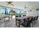 Outdoor patio with tables, chairs and ceiling fans overlooking a refreshing community pool at 1130 Hominy Hill Dr, Trinity, FL 34655