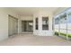 Relaxing outdoor space with sliding glass doors that create a seamless transition to the interior at 1130 Hominy Hill Dr, Trinity, FL 34655