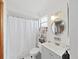 Clean bathroom with shower, vanity, and mirror, offering functionality and style at 11337 Knights Griffin Rd, Thonotosassa, FL 33592