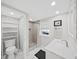 Updated bathroom with patterned tile floor, shower with tiled walls, and new vanity at 11337 Knights Griffin Rd, Thonotosassa, FL 33592