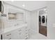 Bright bathroom featuring walk-in closet, new vanity, decorative tile, and updated shower at 11337 Knights Griffin Rd, Thonotosassa, FL 33592