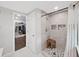 Updated shower boasts neutral tile, decorative shower seat, and decorative inlay at 11337 Knights Griffin Rd, Thonotosassa, FL 33592