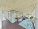 Spacious deck with outdoor seating, barbecue grill, and lake views at 11337 Knights Griffin Rd, Thonotosassa, FL 33592