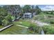 Lovely waterfront home on a large lot with a dock and screened balconies overlooking the lake at 11337 Knights Griffin Rd, Thonotosassa, FL 33592