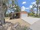 Spacious garage with ample storage, adjacent to a well-maintained driveway at 11337 Knights Griffin Rd, Thonotosassa, FL 33592
