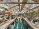 Sun-drenched greenhouse with wooden beams and an abundance of natural light for growing plants at 11337 Knights Griffin Rd, Thonotosassa, FL 33592