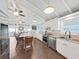 Well-lit kitchen with a center island, stainless appliances, and hardwood floors at 11337 Knights Griffin Rd, Thonotosassa, FL 33592