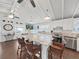 Open concept kitchen with large island, stainless appliances, and bar seating at 11337 Knights Griffin Rd, Thonotosassa, FL 33592