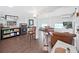 Spacious living room with hardwood floors, neutral colors, and lots of natural light at 11337 Knights Griffin Rd, Thonotosassa, FL 33592
