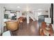 Large living room featuring hardwood floors, neutral colors, and access to an office at 11337 Knights Griffin Rd, Thonotosassa, FL 33592