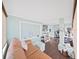 Bright living room with hardwood floors, neutral colors, and large windows at 11337 Knights Griffin Rd, Thonotosassa, FL 33592