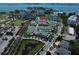 Aerial view of townhouses in a community with a golf course and waterfront access at 12 Country Club Ln, Belleair, FL 33756