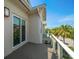 This is the view from the balcony featuring sliding glass doors at 12 Country Club Ln, Belleair, FL 33756