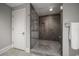 Modern bathroom with a frameless glass shower and neutral tile at 12 Country Club Ln, Belleair, FL 33756