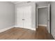 Bedroom featuring hardwood floors, neutral paint, and closet at 12 Country Club Ln, Belleair, FL 33756