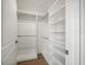 Walk-in closet with custom shelving and ample storage space at 12 Country Club Ln, Belleair, FL 33756