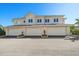 Townhouse exterior with a two-story design and individual garages, showcasing a well-maintained facade at 12 Country Club Ln, Belleair, FL 33756