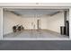 A spacious, two-car garage with a clean concrete floor and ample room for storage or vehicles at 12 Country Club Ln, Belleair, FL 33756