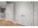 Bright hallway featuring beautiful oak floors and white trim at 12 Country Club Ln, Belleair, FL 33756