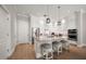 Bright kitchen with white cabinetry, stainless steel appliances, and a breakfast bar at 12 Country Club Ln, Belleair, FL 33756