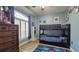 Charming bedroom with bunk beds, natural light, and blue walls perfect for a room or guest room at 12808 Killarney Ct, Odessa, FL 33556