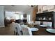 Open-concept dining area with stylish furnishings, seamlessly flowing into the living space at 12808 Killarney Ct, Odessa, FL 33556
