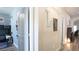 Bright hallway leading to bedrooms and living spaces, showcasing modern flooring and stylish decor at 12808 Killarney Ct, Odessa, FL 33556