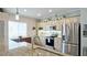 Well-equipped kitchen featuring granite countertops, stainless steel appliances, and ample cabinet space at 12808 Killarney Ct, Odessa, FL 33556