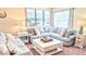 Cozy living room with a large sectional sofa, white coffee table, and stylish decor at 12808 Killarney Ct, Odessa, FL 33556