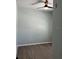 Minimalist bedroom featuring wood-look floors and a ceiling fan at 14510 Mj Rd, Myakka City, FL 34251