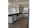 Kitchen featuring stainless steel appliances, granite countertops, and stylish pendant lighting at 14510 Mj Rd, Myakka City, FL 34251